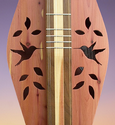 Dulcimer Sounholes at https://gibsondulcimers.com/dulcimer_soundholes.html